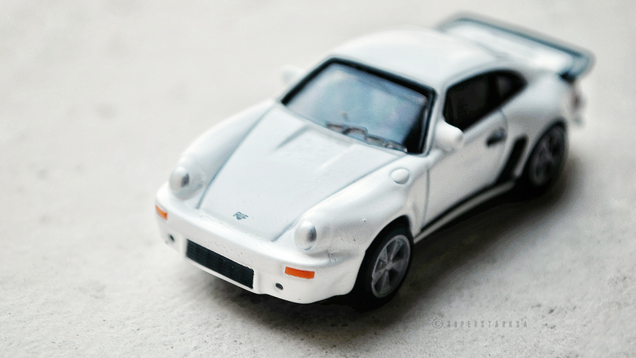 Illustration for article titled Rennsport Reunion: 1:72 UCC Coffee Special RUF 930 Turbo